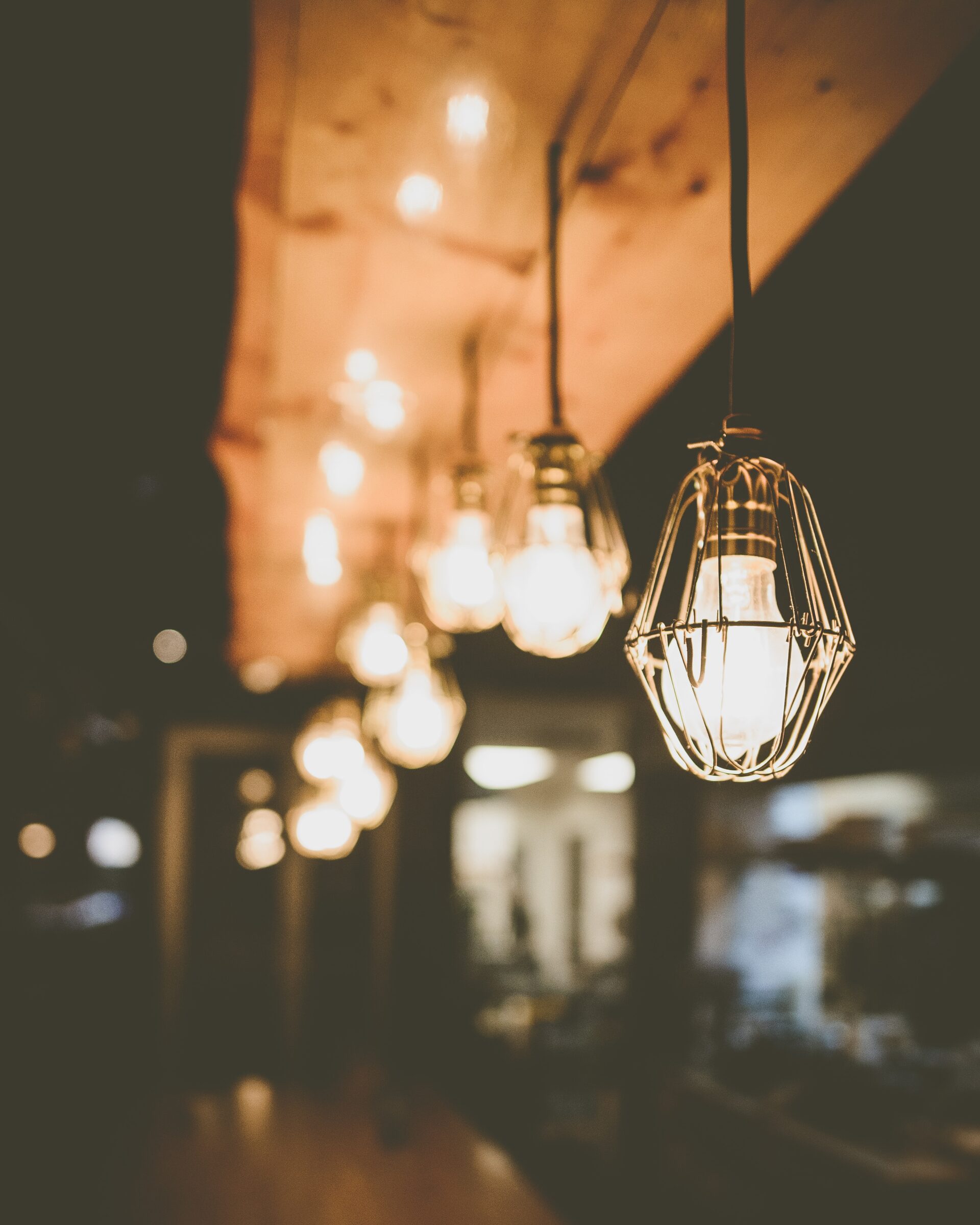 A string of lights inside a residential or commercial building.